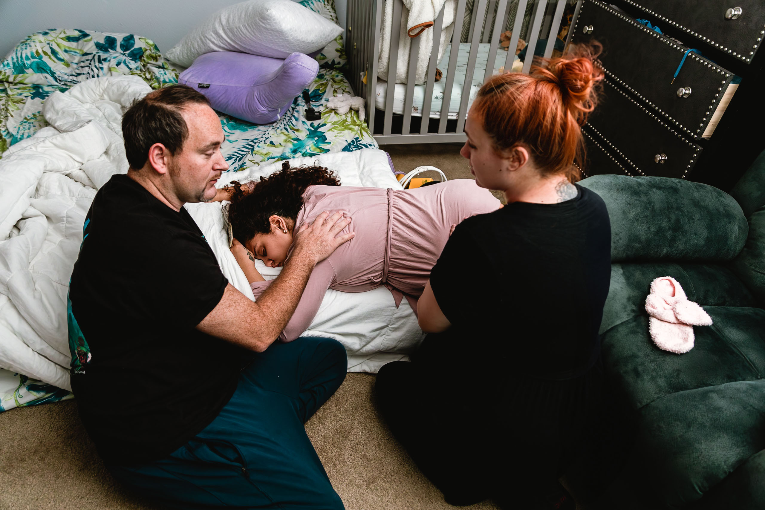 Providing emotional and physical support as a doula while capturing meaningful birth photography moments during a homebirth in Ocala, Florida.