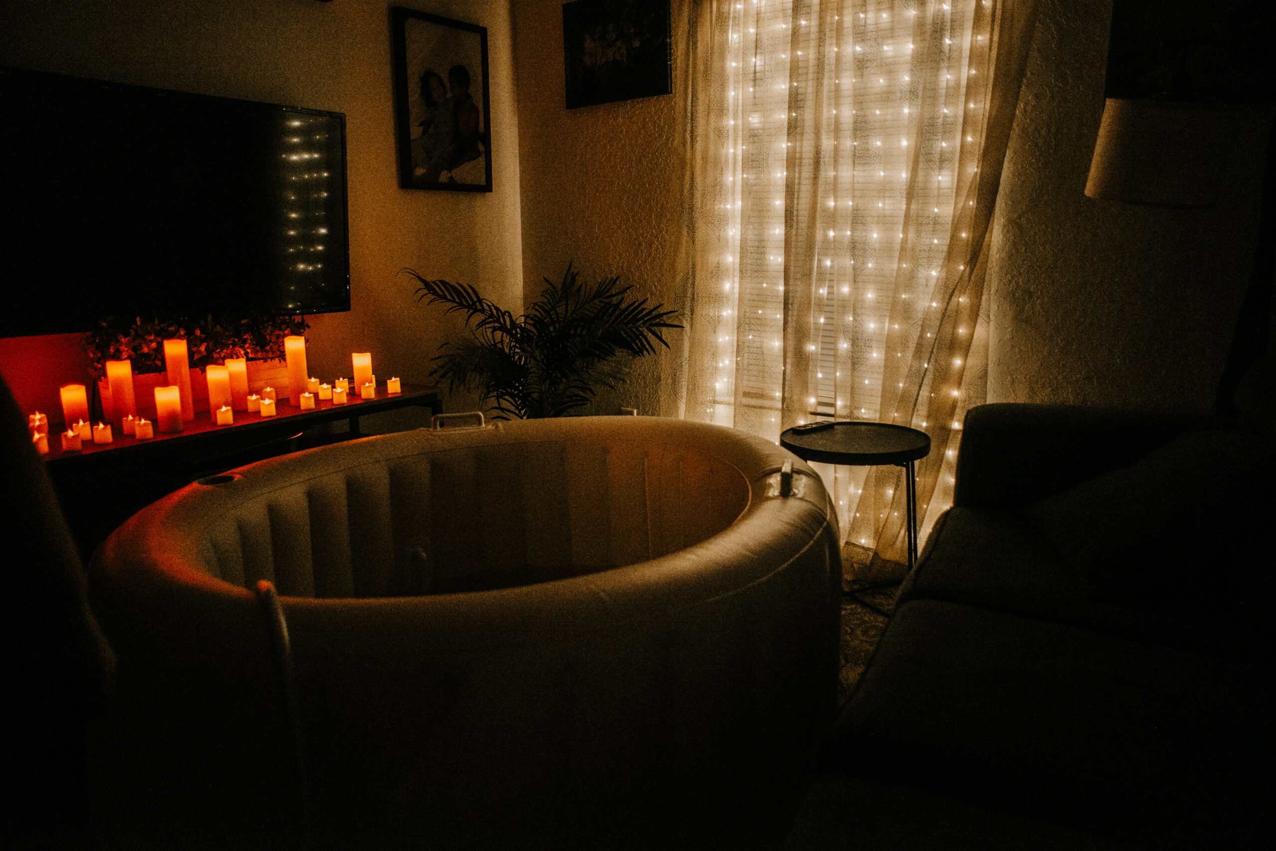 Beautifully prepared homebirth space in Ocala, Florida, featuring a white birth pool, flameless candles, and twinkle lights, designed to create a calm and empowering atmosphere.